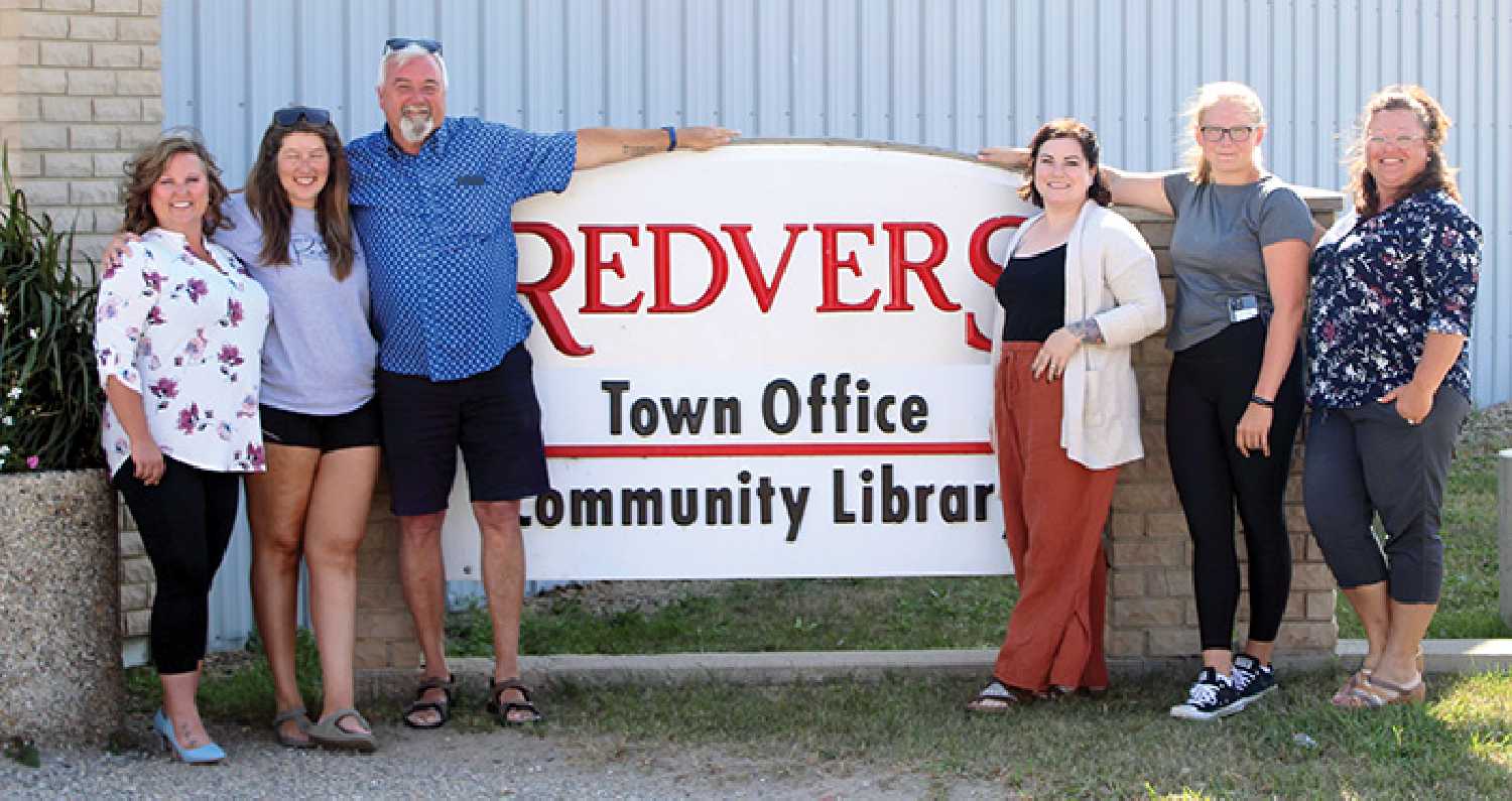 Where else would you want to pose for a photo when your name and the town’s are the same? From left are Tricia Pickard, Dayna Germain, Redvers McGrath, Jena Cowan, Kaylee Ohnander, and Raylene Gordon.